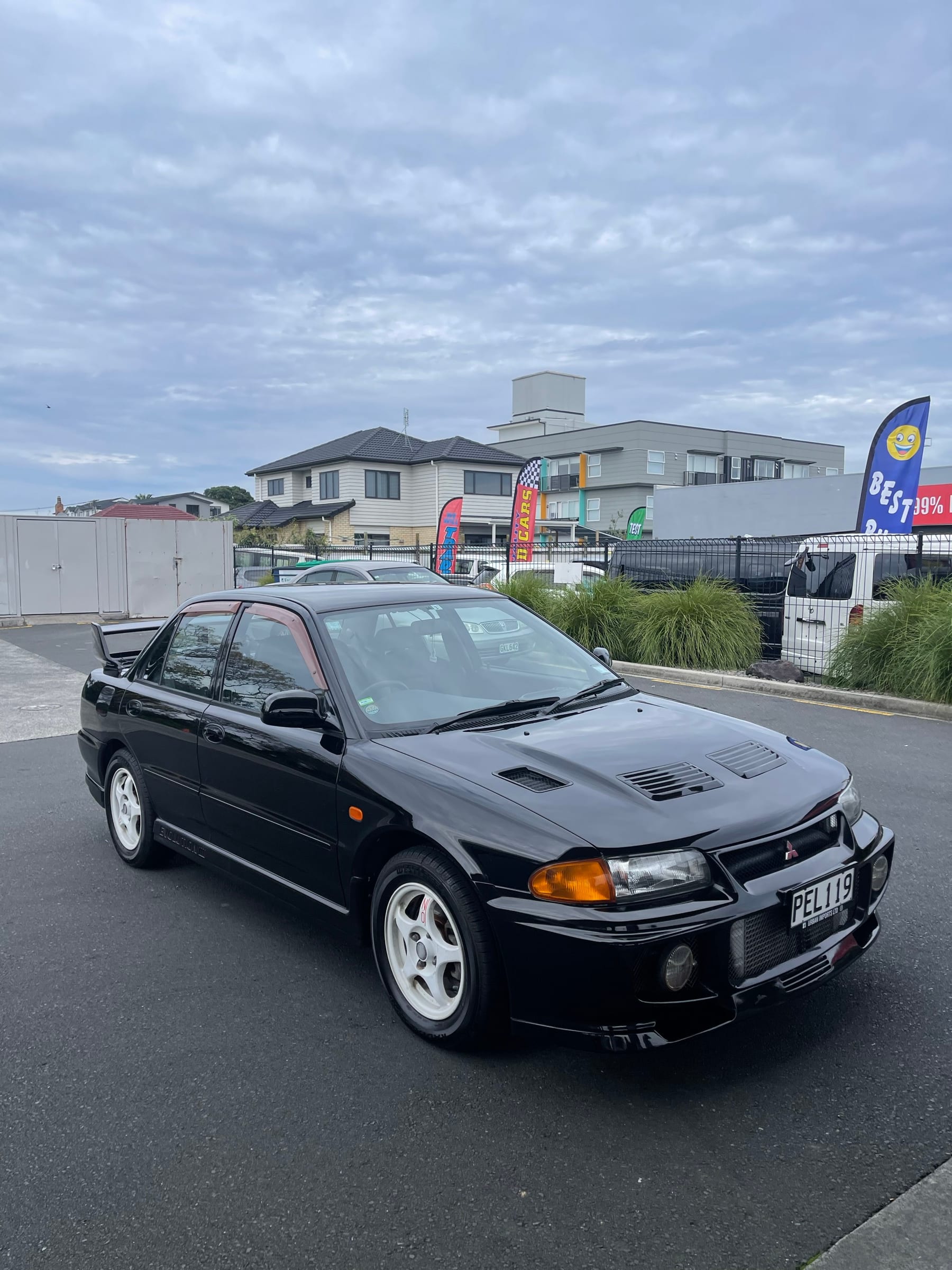A black Mitsubishi Lancer Evolution imported by Urban Imports